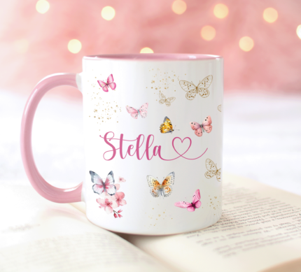 Personalised Butterfly Mug with pink handle and inside, with pink butterflies on mug, name in cursive on the front with heart, personal message can be added to the back of the coffee cup.